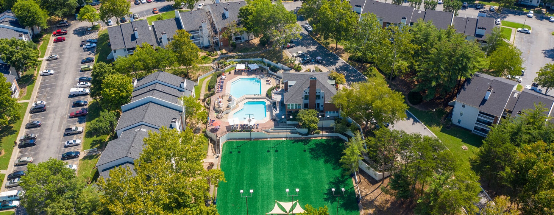 A drone view of the pool and buildings at Lyric on Bell Apartments in Nashville, Tennessee